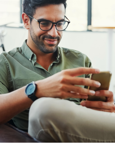 Man looking at smartphone.