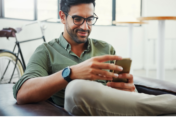 Man looking at smartphone.