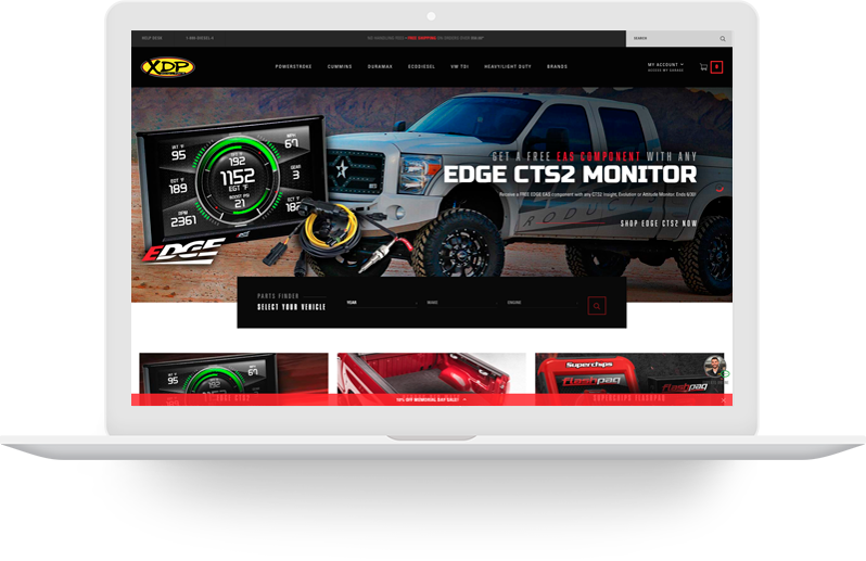 Laptop with automotive website displayed.